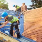 A-group-of-men-working-on-a-roof-in-Logan-Utah